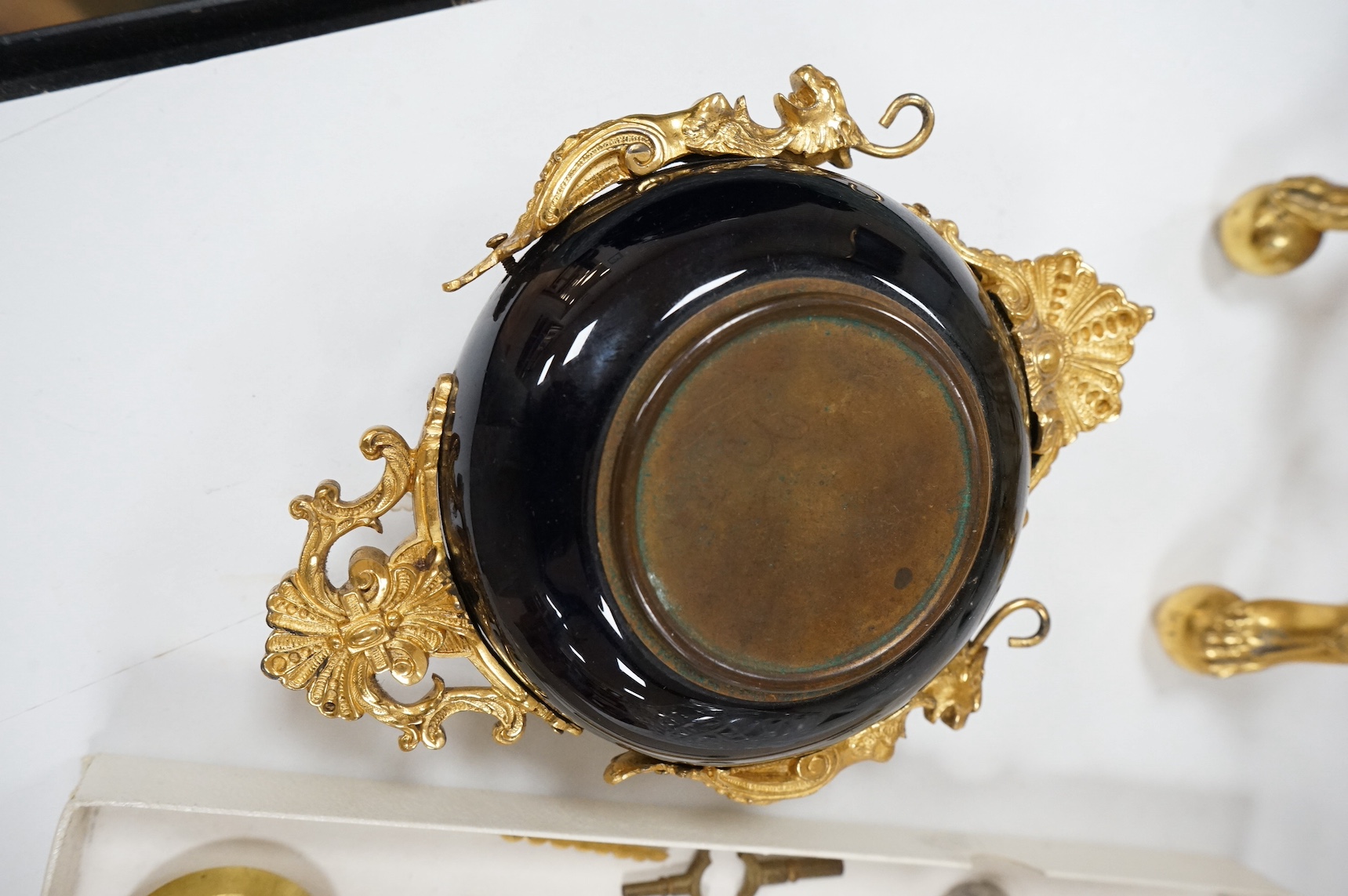 An unusual enamel and gilt brass timepiece, pendant from gilt brass frame, stand 26cm high. Condition - dismantled